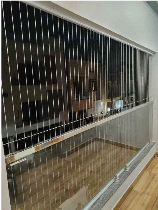 Invisible grill installation on a balcony